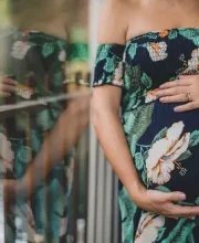 Happy mother in Abu Dhabi sharing her positive birth experience with Caring Silvy services.